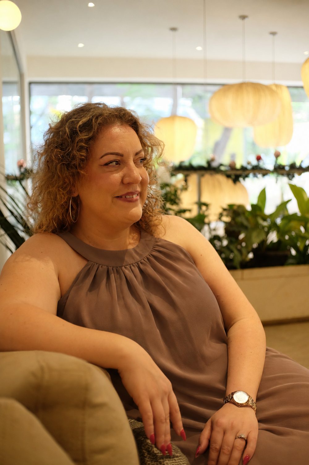 Madi, founder of Less Faff VA, seated and smiling
